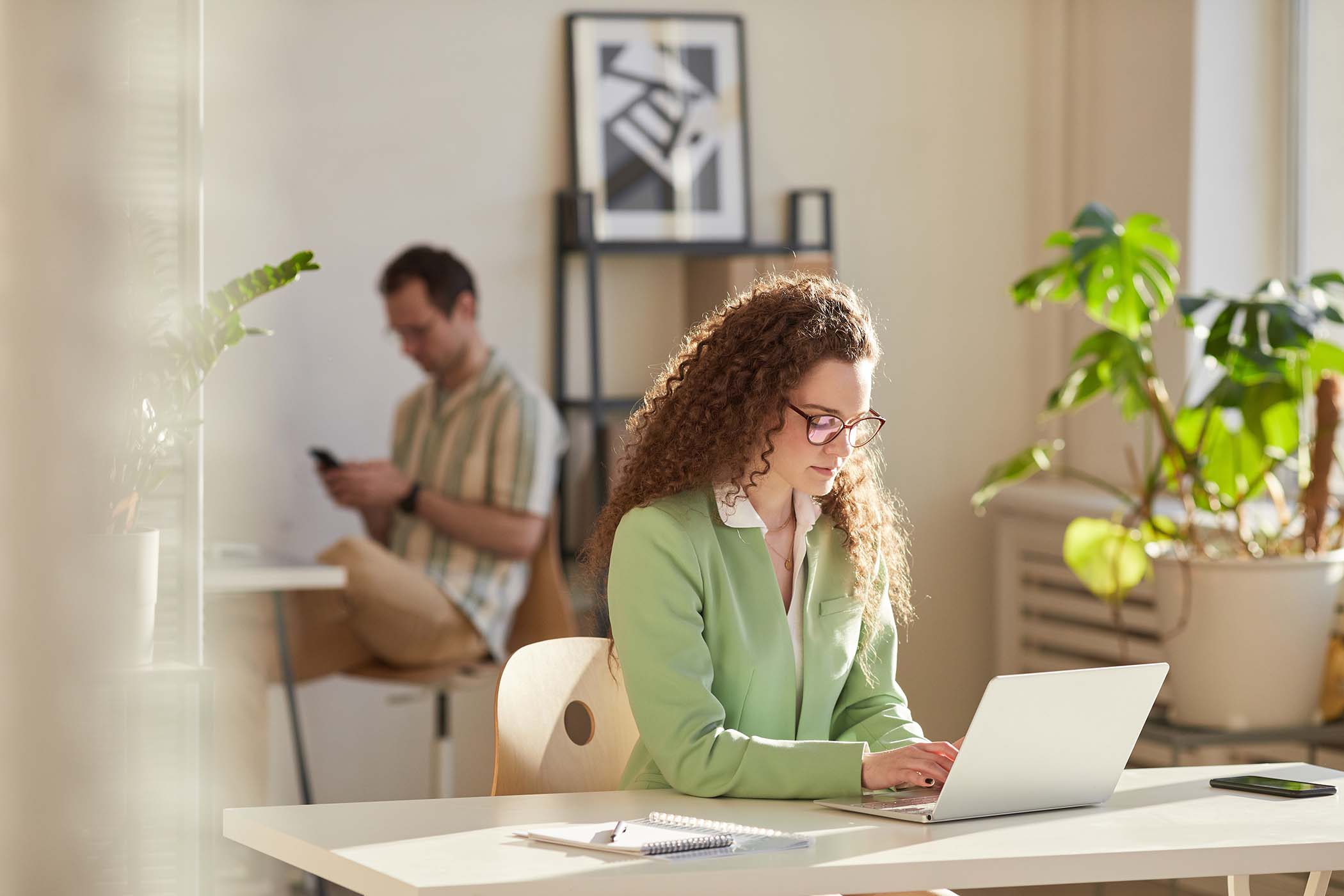 man-and-woman-working-in-office-EECVUMA.jpg